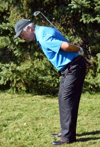 The spine angle is set at address when the golfer stands erect and bows forward, letting the hips drop back. Relax the upper back let the arms hang down relax the knees a bit.