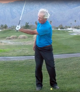 Hold the club in your left hand only. Take the club back and up with your left arm. 