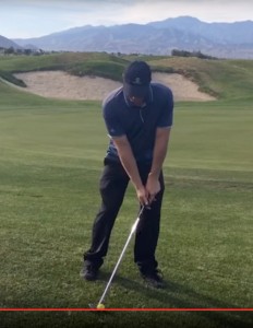 To de-loft, place the golf ball back in the stance and move the hands forward.